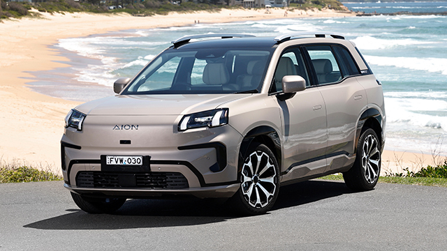 GAC AION V electric SUV front three-quarter view by the beach